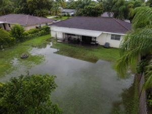 Topographic Survey of a flood prone backyard in Miramar Florida showing standing water near a home before regrading.