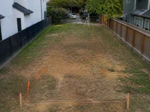House stakeout showing survey stakes and building layout on a narrow residential lot in Miramar FL